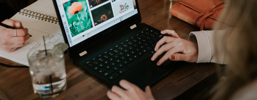 woman using black laptop computer